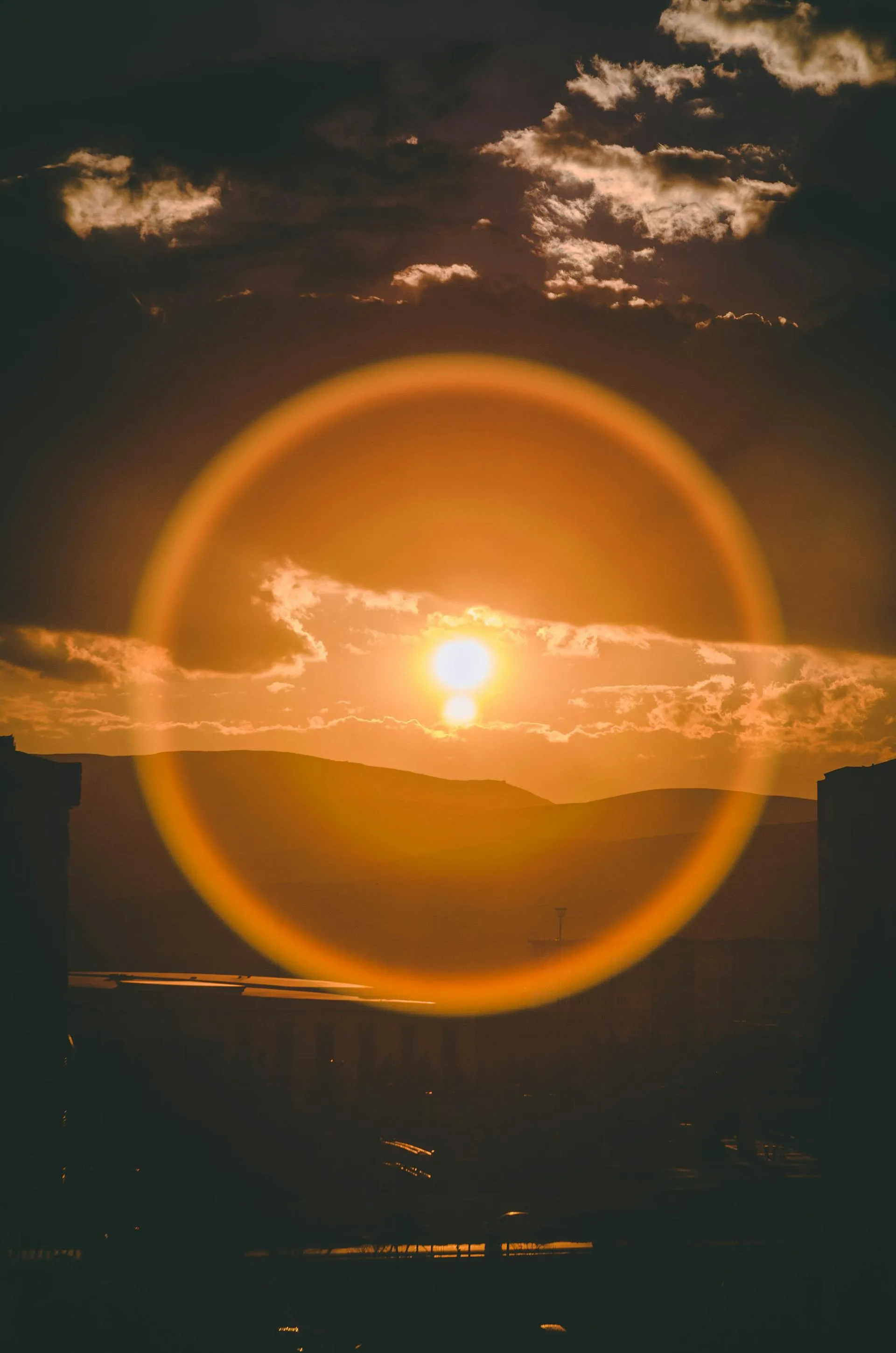 Sun setting behind solar infrastructure